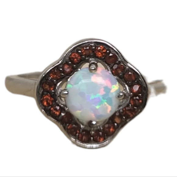 Sterling Silver Garnet Created White Opal Flower Ring - Picture 16 of 16